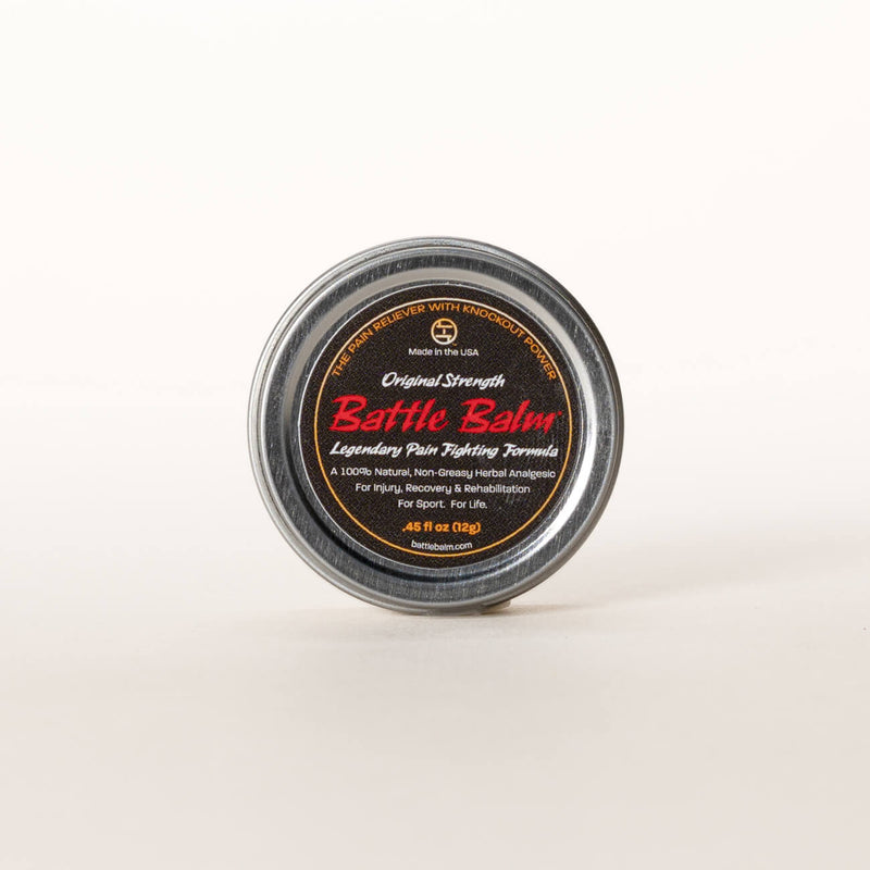 Small tin containing a pain relieving balm 
