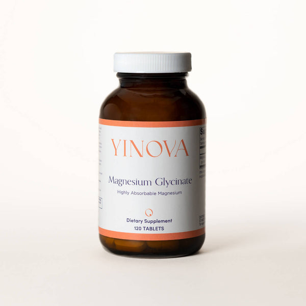 clear brown bottle containing Yinova’s blend of Magnesium Glycinate tablets